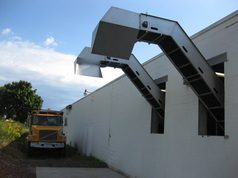 Pomace removal conveyors outside a winery